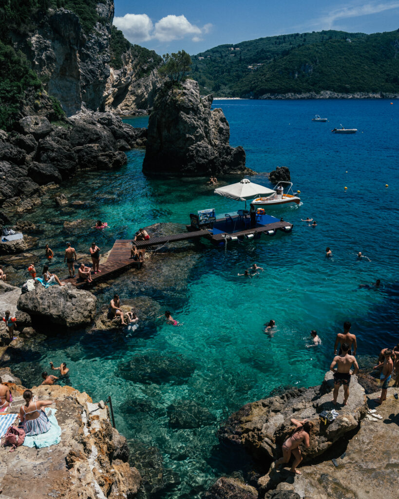 A complete travel guide to Corfu, Greece including the best beaches, cliff jumping, viewpoints, hotels, restaurants, beach bars, Google Map pins and more.