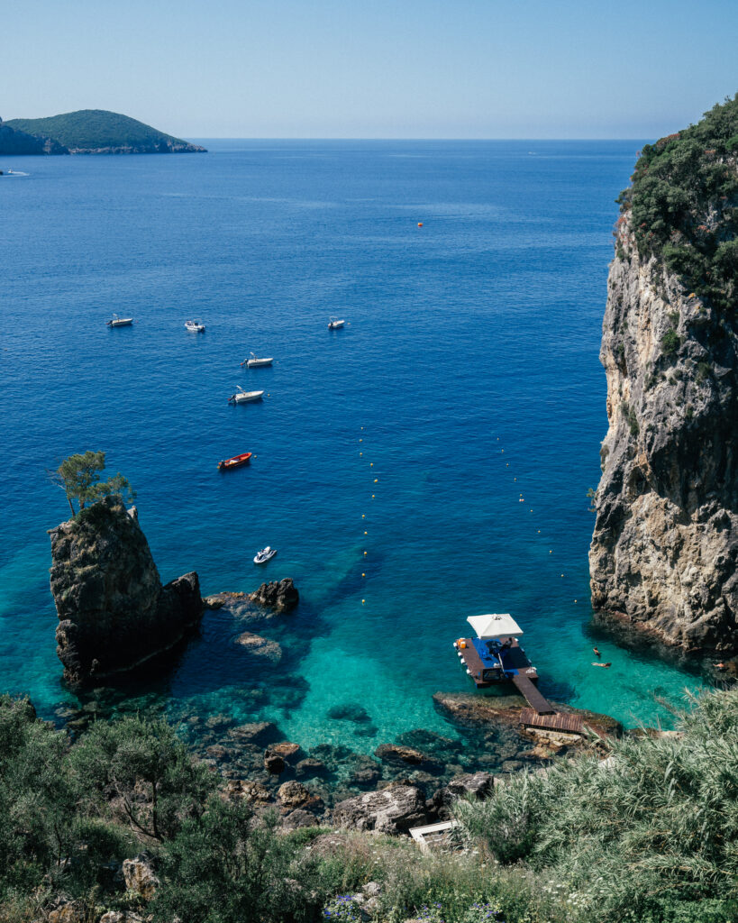 A complete travel guide to Corfu, Greece including the best beaches, cliff jumping, viewpoints, hotels, restaurants, beach bars, Google Map pins and more.